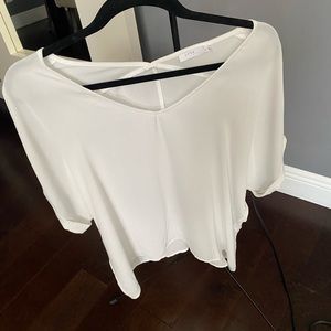 Lush white semi cold shoulder flowy top. Size medium and brand is Lush.
